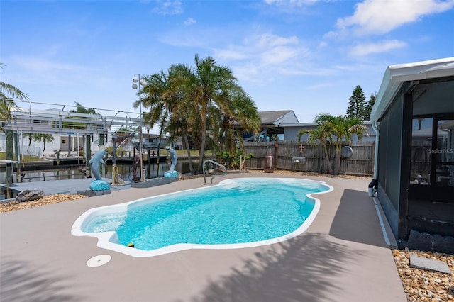 13411 Lisa Dr, Hudson, FL 34667 - view of swimming pool with fence and a patio area