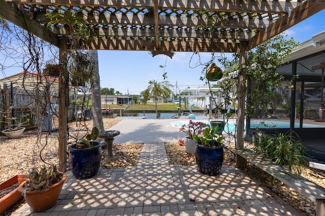13411 Lisa Dr, Hudson, FL 34667 - view of patio / terrace featuring a pergola, a water view, and fence