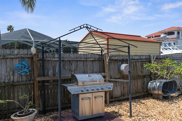 13411 Lisa Dr, Hudson, FL 34667 - view of patio / terrace featuring a grill and fence