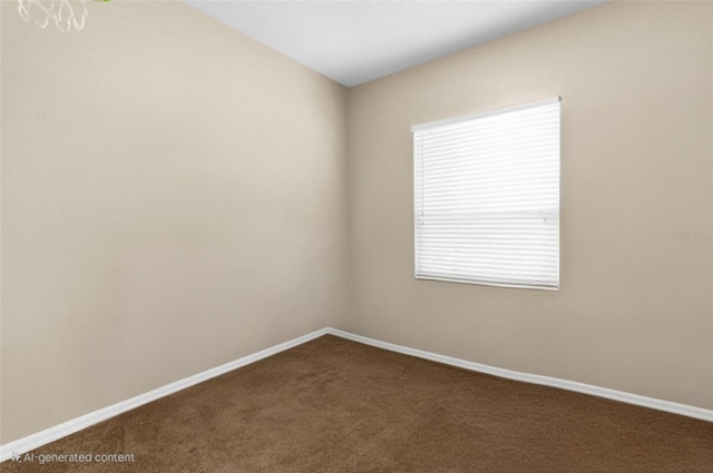 empty room with dark carpet and baseboards