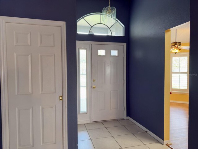 18109 Webster Grove Dr, Hudson, FL 34667 - foyer featuring light tile patterned flooring and baseboards