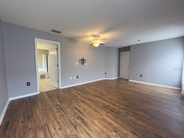 18109 Webster Grove Dr, Hudson, FL 34667 - empty room with a ceiling fan, a textured ceiling, wood finished floors, and baseboards