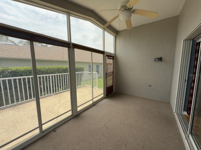 18109 Webster Grove Dr, Hudson, FL 34667 - unfurnished sunroom featuring a ceiling fan, healthy amount of natural light, and vaulted ceiling