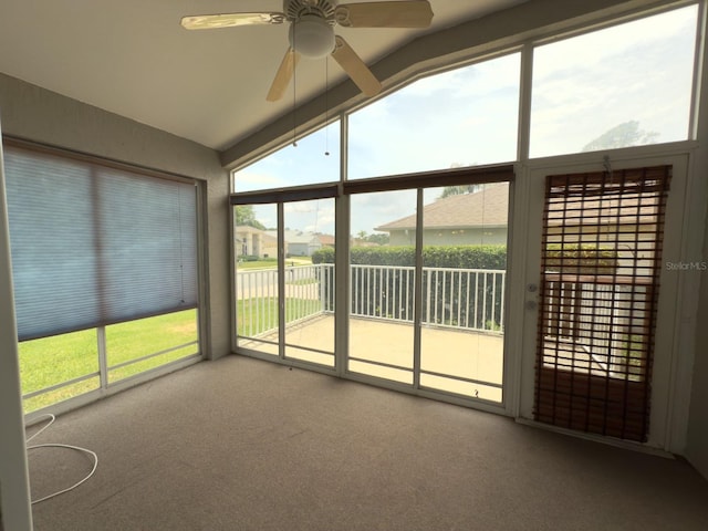 18109 Webster Grove Dr, Hudson, FL 34667 - unfurnished sunroom with lofted ceiling and plenty of natural light