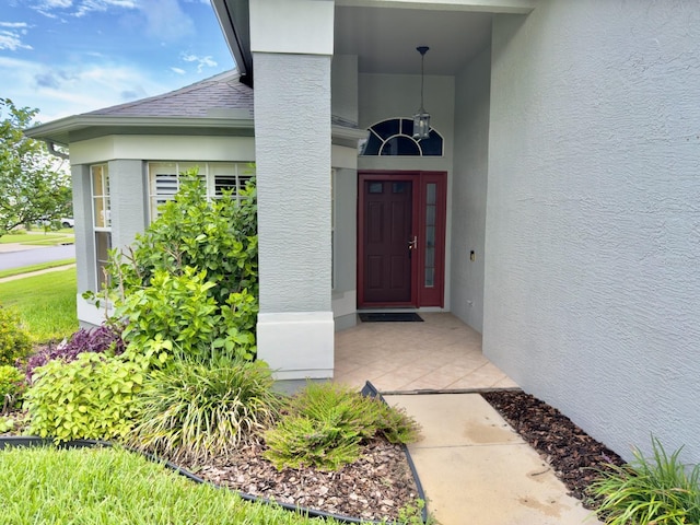 18109 Webster Grove Dr, Hudson, FL 34667 - view of exterior entry featuring stucco siding