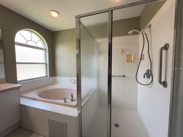 18109 Webster Grove Dr, Hudson, FL 34667 - bathroom with a stall shower, a bath, a textured ceiling, and vanity