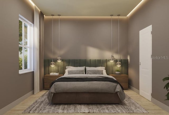 bedroom with light wood-style floors