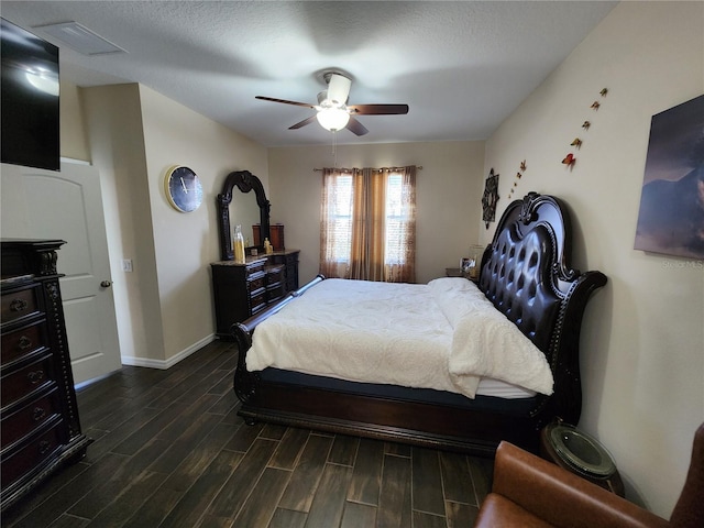 bedroom with dark wood finished floors, baseboards, and ceiling fan