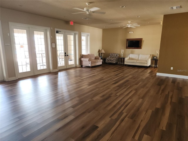 living area with french doors, a ceiling fan, dark wood-style flooring, baseboards, and recessed lighting