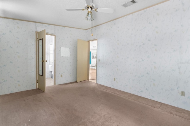 6802 Curlew Ln, Hudson, FL 34667 - carpeted empty room with ornamental molding, ceiling fan, and a textured ceiling