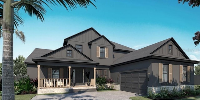 5477 Creek Ridge Rd, Brooksville, FL 34601 - view of front of home with a porch, board and batten siding, an attached garage, and driveway