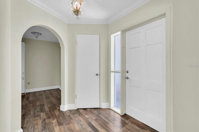 1402 Tallahassee Dr, Tarpon Springs, FL 34689 - entryway with arched walkways, wood finished floors, crown molding, baseboards, and a chandelier