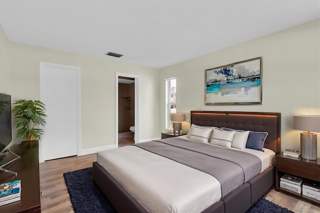 1402 Tallahassee Dr, Tarpon Springs, FL 34689 - bedroom with wood finished floors and baseboards