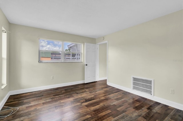 1402 Tallahassee Dr, Tarpon Springs, FL 34689 - empty room with wood finished floors and baseboards