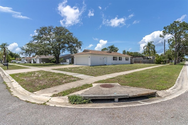 1402 Tallahassee Dr, Tarpon Springs, FL 34689 - ranch-style home with driveway and an attached garage