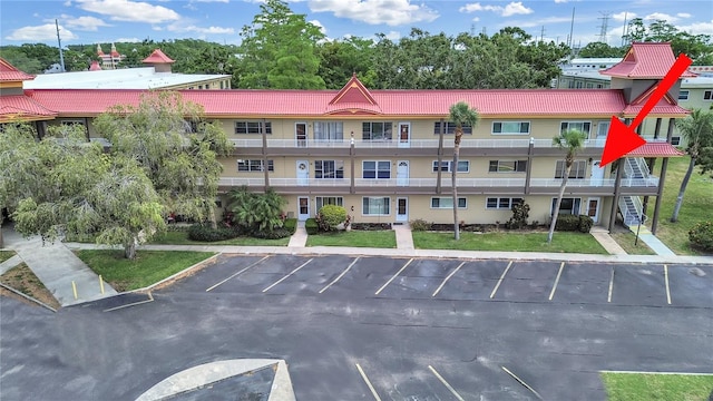 view of property with uncovered parking