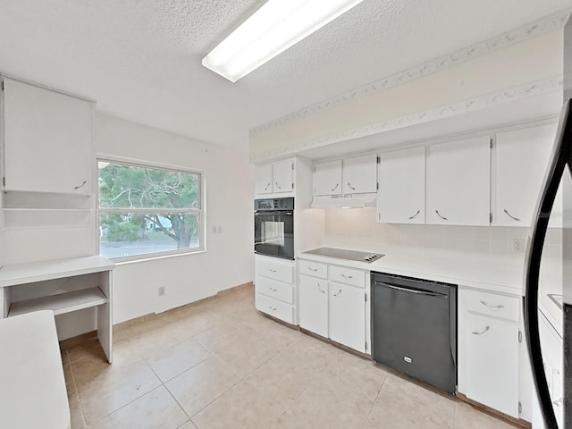 kitchen with black appliances, under cabinet range hood, light countertops, white cabinets, and a textured ceiling