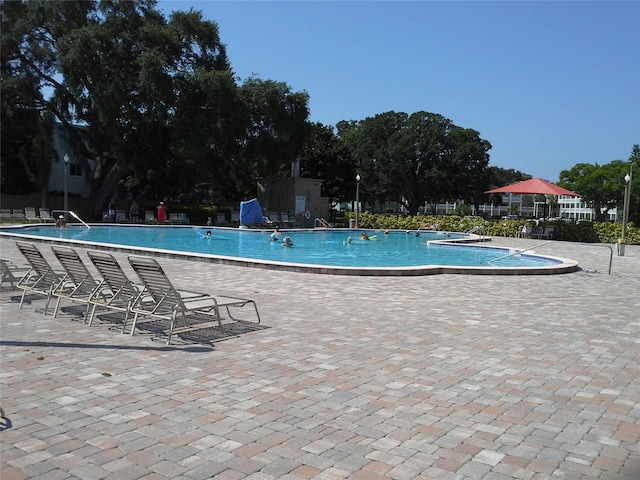 community pool with a patio