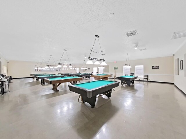 playroom featuring billiards and a textured ceiling