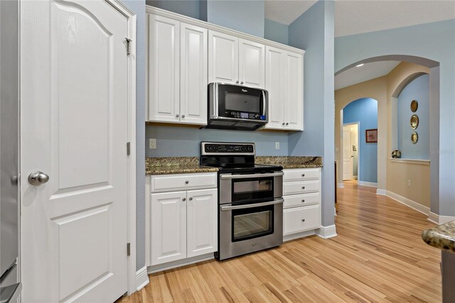 11401 Quiet Forest Dr, Tampa, FL 33635 - kitchen featuring appliances with stainless steel finishes, light wood-style flooring, and white cabinetry