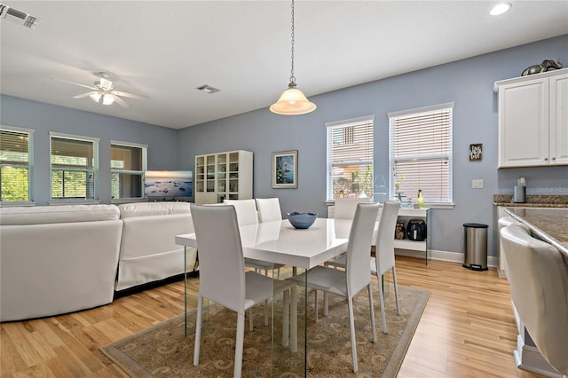 11401 Quiet Forest Dr, Tampa, FL 33635 - dining space with light wood finished floors, ceiling fan, recessed lighting, and baseboards