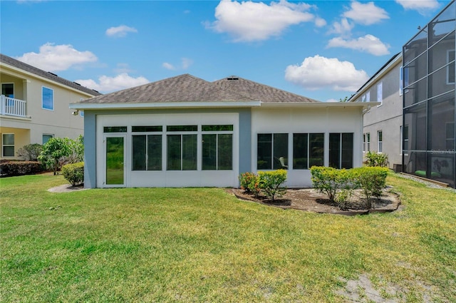 11401 Quiet Forest Dr, Tampa, FL 33635 - back of property featuring stucco siding, a yard, glass enclosure, and a shingled roof