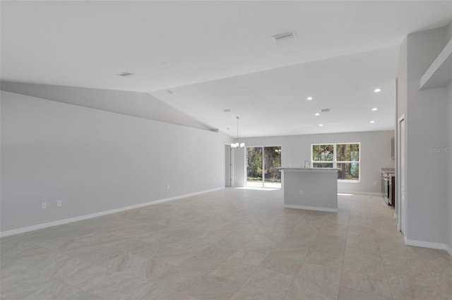 unfurnished living room featuring a chandelier, lofted ceiling, baseboards, and recessed lighting