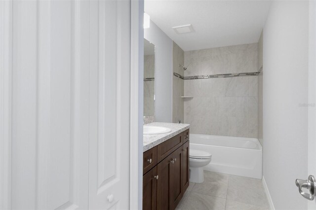 bathroom featuring vanity, shower / bath combination, toilet, tile patterned flooring, and baseboards