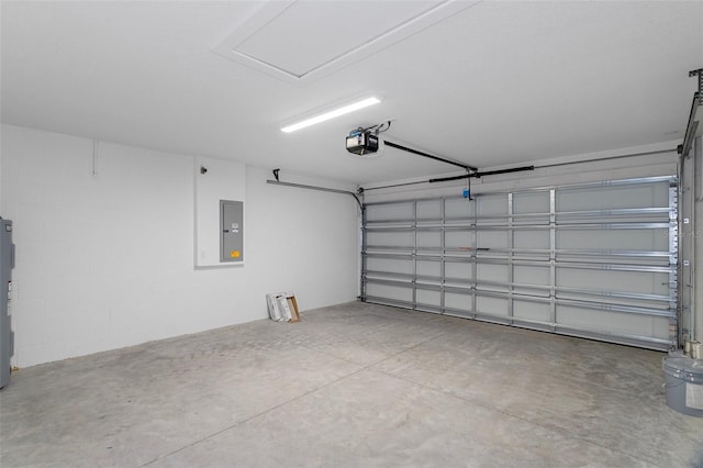 garage featuring a garage door opener, electric panel, and electric water heater