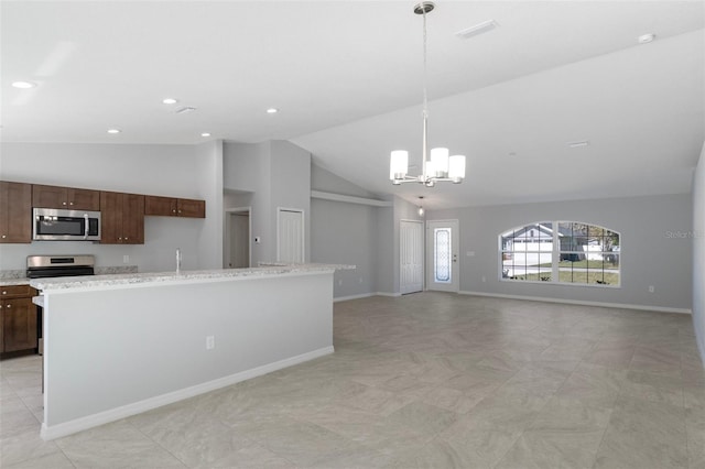12192 Eskimo Curlew Rd, Weeki Wachee, FL 34614 - kitchen with appliances with stainless steel finishes, vaulted ceiling, a chandelier, baseboards, and decorative light fixtures