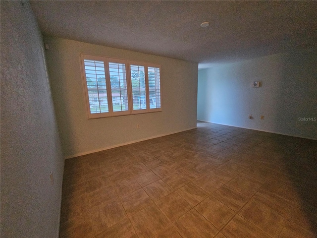 6339 Delaware Ave, New Port Richey, FL 34653 - empty room featuring a textured ceiling
