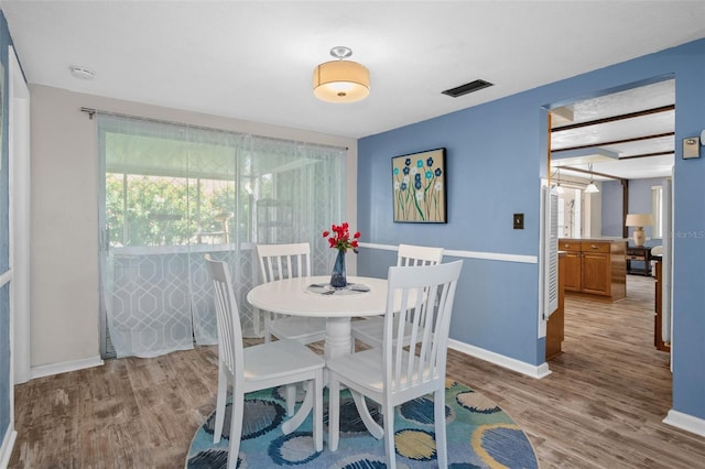 8021 Wildflower Row, Hudson, FL 34667 - dining space with wood finished floors and baseboards