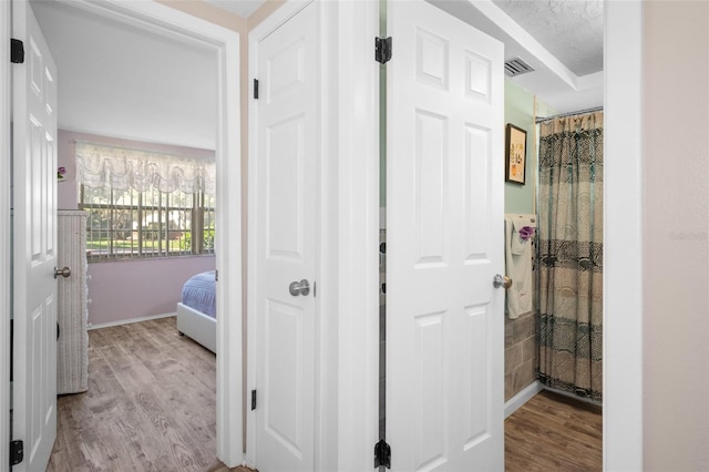 8021 Wildflower Row, Hudson, FL 34667 - hall with wood finished floors