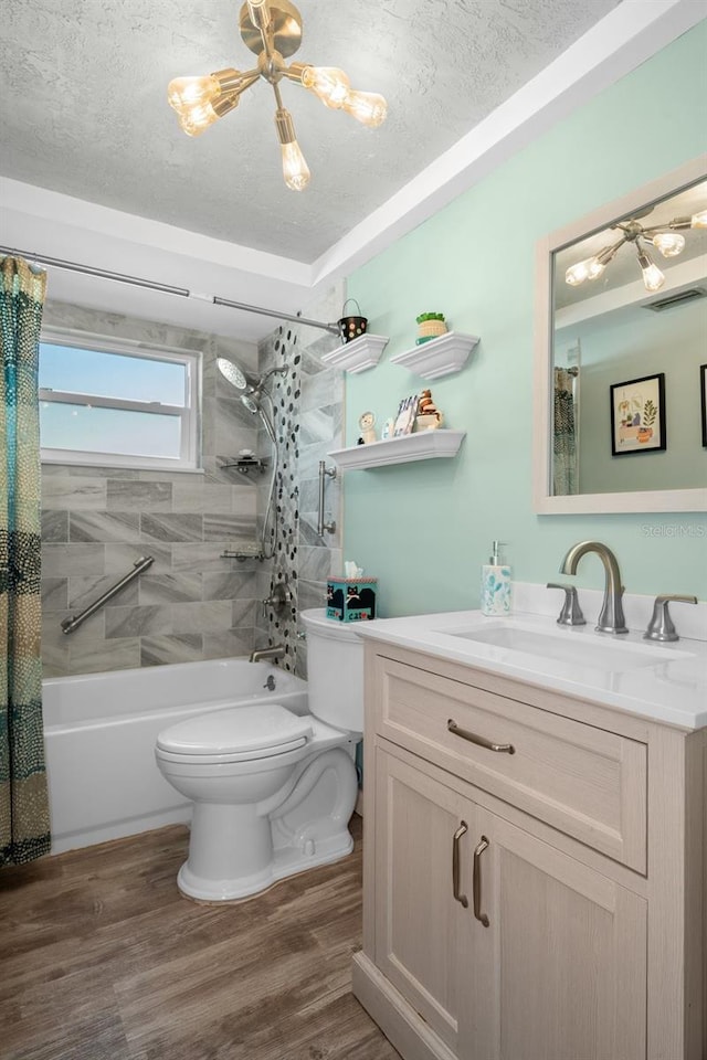 8021 Wildflower Row, Hudson, FL 34667 - full bath with toilet, shower / bathtub combination with curtain, vanity, wood finished floors, and a textured ceiling