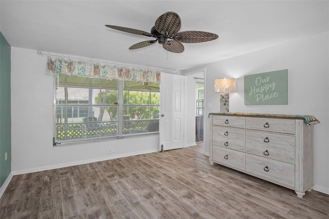 8021 Wildflower Row, Hudson, FL 34667 - bedroom featuring wood finished floors, baseboards, and ceiling fan