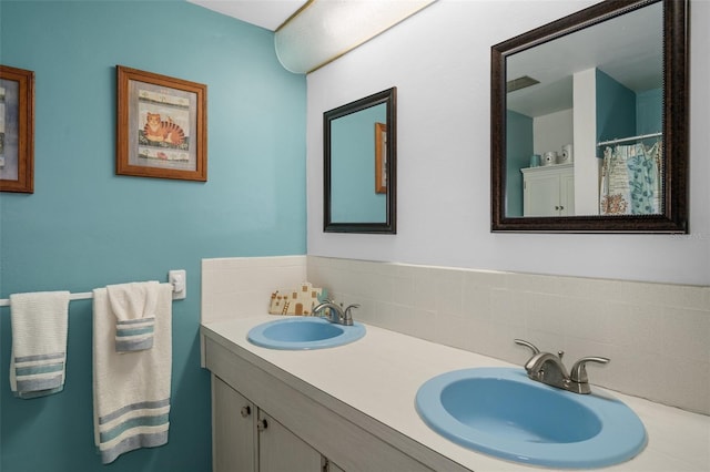 8021 Wildflower Row, Hudson, FL 34667 - bathroom featuring backsplash and double vanity