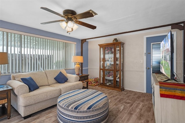8021 Wildflower Row, Hudson, FL 34667 - living room with wood finished floors and a ceiling fan