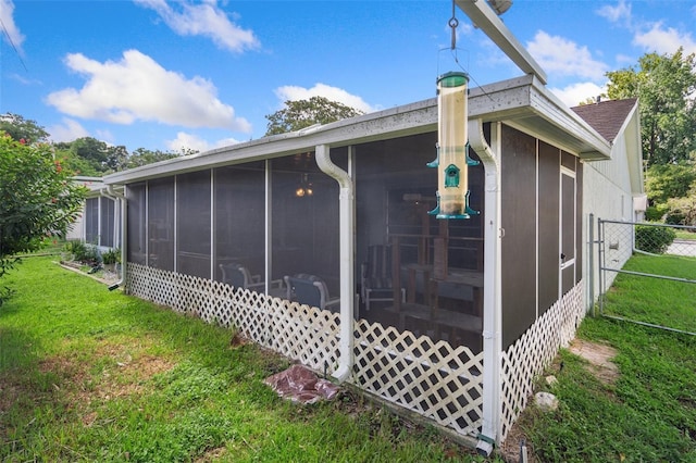 8021 Wildflower Row, Hudson, FL 34667 - rear view of house featuring a sunroom
