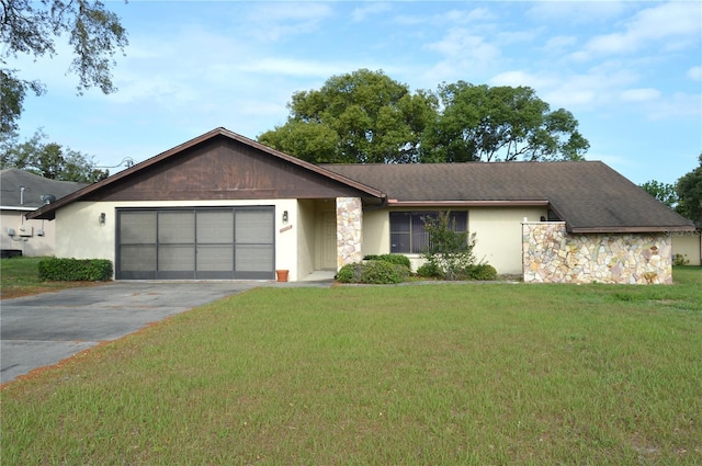 13425 Bonita Ave, Spring Hill, FL 34609 - view of front of house featuring stone siding, asphalt driveway, a garage, a front yard, and stucco siding