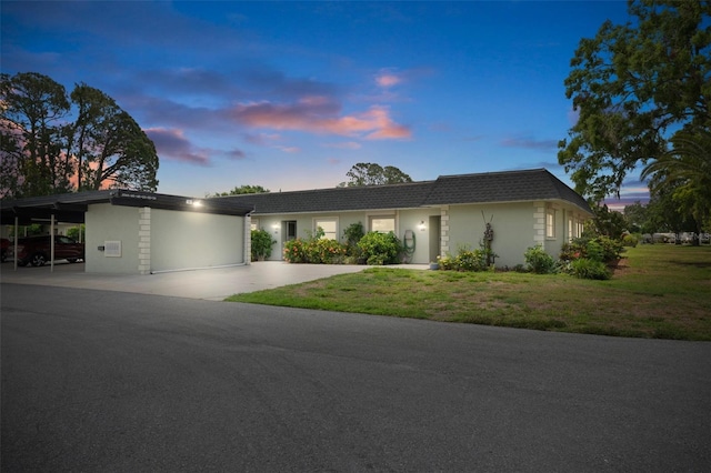view of front facade featuring a front yard and stucco siding