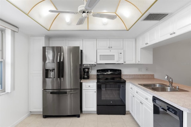 kitchen featuring black appliances, a sink, light countertops, white cabinetry, and a ceiling fan