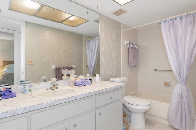 full bath with vanity, toilet, tile patterned floors, and shower / bath combo with shower curtain