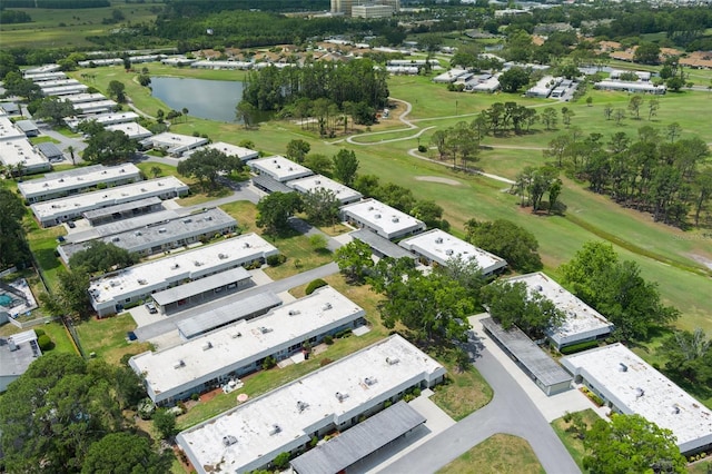 view of property location with a large body of water and a local golf course