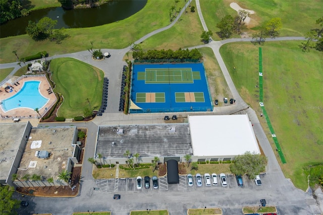 bird's eye view of a large body of water, a pool area, and a golf club