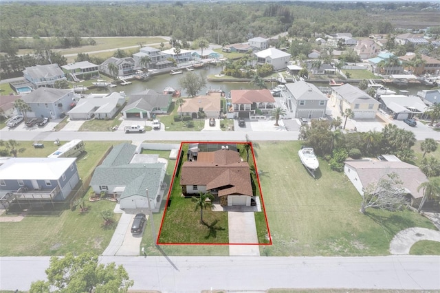 7520 Mako Dr, Hudson, FL 34667 - aerial view of residential area with property boundaries highlighted and a nearby body of water