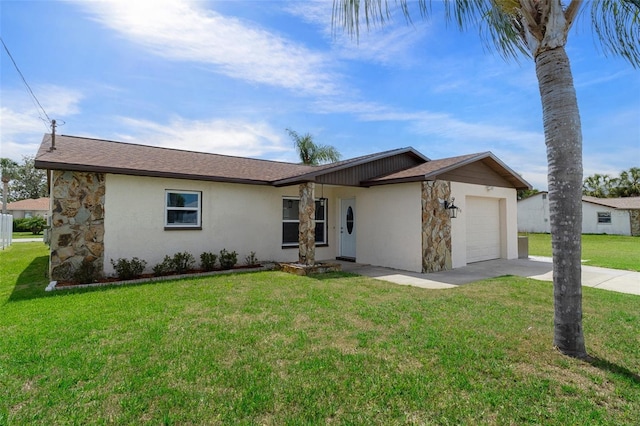 7520 Mako Dr, Hudson, FL 34667 - view of front of house featuring an attached garage, driveway, stucco siding, and a front yard