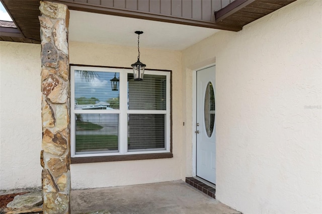 7520 Mako Dr, Hudson, FL 34667 - doorway to property with stucco siding