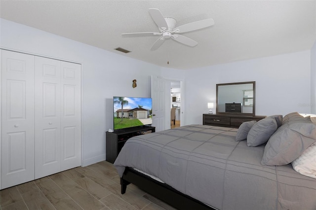 7520 Mako Dr, Hudson, FL 34667 - bedroom with a closet, a ceiling fan, and wood finished floors