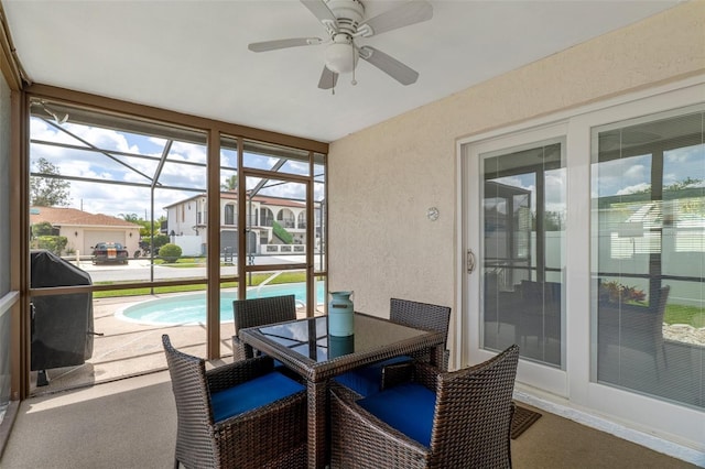 7520 Mako Dr, Hudson, FL 34667 - sunroom / solarium with a ceiling fan and outdoor dining space