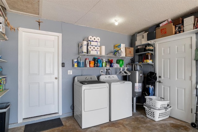 7520 Mako Dr, Hudson, FL 34667 - washroom featuring washing machine and dryer, electric water heater, and a textured ceiling